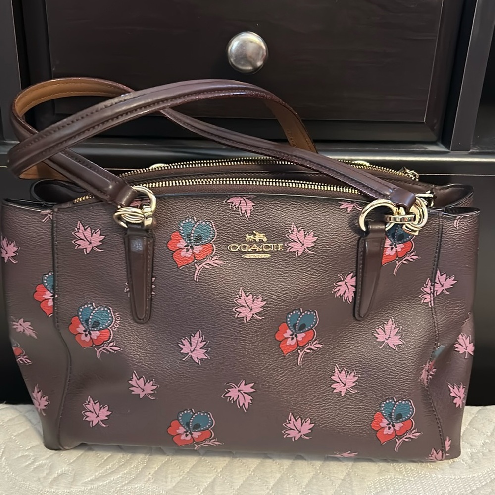 Gently used. Coach medium tote. deep purple with floral design